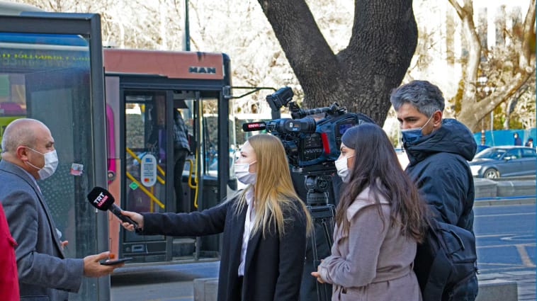 TV news reporter interviewing